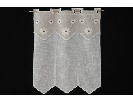 Window curtain with creme colored decoration and edelweiss